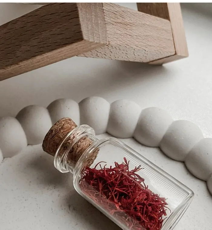 Saffron threads in a glass jar
