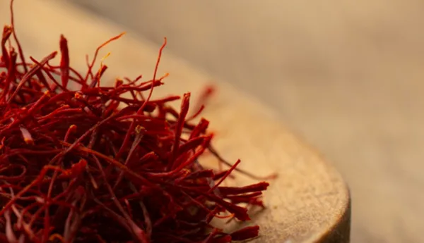 Saffron threads on a wooden spoon